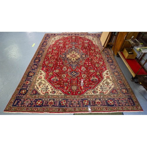 510 - PERSIAN RED GROUND RUG. MEASURES 350 X 250CM