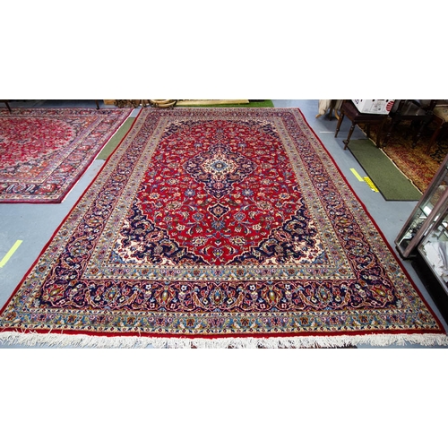 511 - RED GROUND PERSIAN KASHAN RUG. 422 X 290 CM