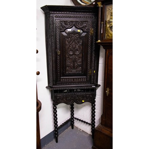 87 - CARVED OAK CORNER CABINET . 181CM HIGH