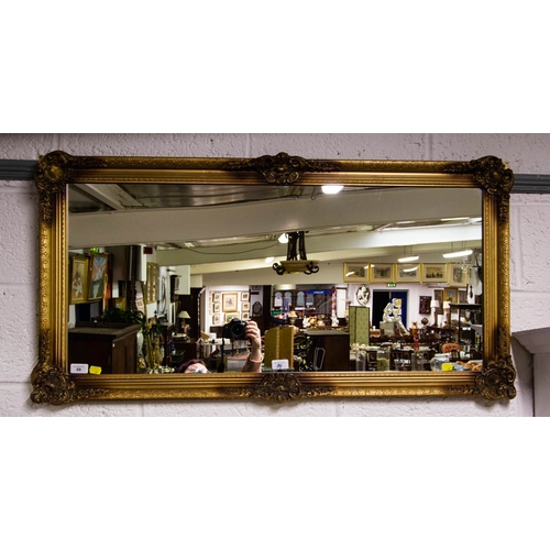 89 - ORNATE GILDED HALL MIRROR. 110 x 57 CM