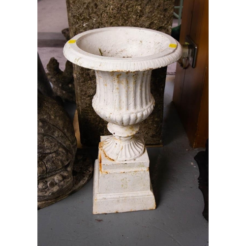 291 - PAIR OF CAST IRON URNS ON PLINTHS 50CM HIGH