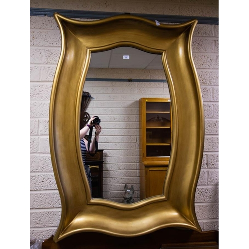 80 - SHAPED GILT MIRROR. 140 X 95CM