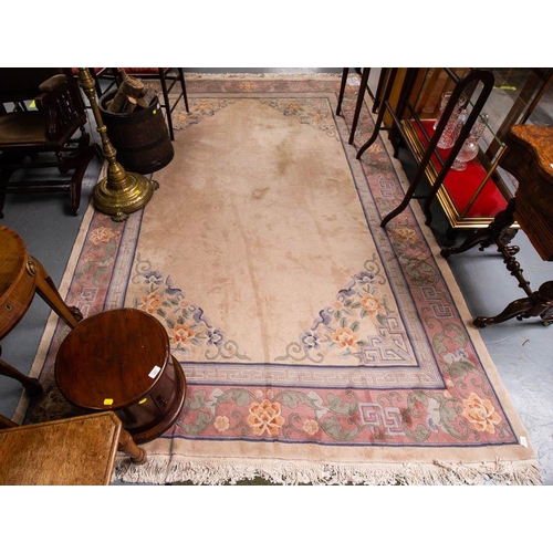 557 - CREAM GROUND CHINESE RUG WITH PINK BORDER. 310 X 200 CM