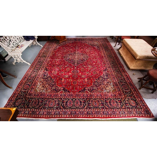 559 - WASHED RED GROUND PERSIAN TABRIZ RUG. 395 X 295CM