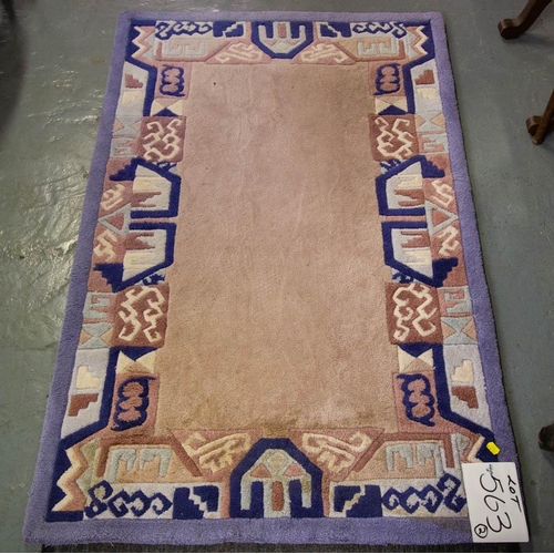 563 - 2 MODERN RUGS. CREAM GROUND WITH PURPLE BORDER. 182 X 122CM AND 150 X 92CM