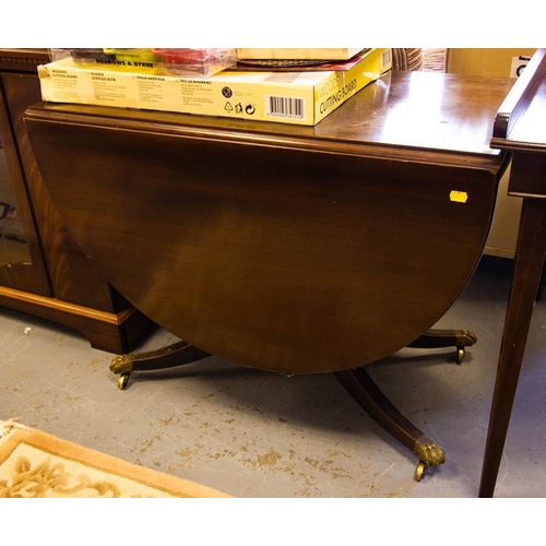 106 - MAHOGANY DROP LEAF TABLE ON BRASS FEET