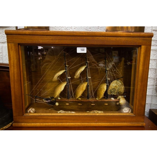122 - SHIP MADE OF SHELLS IN CASE 50 X 38CM