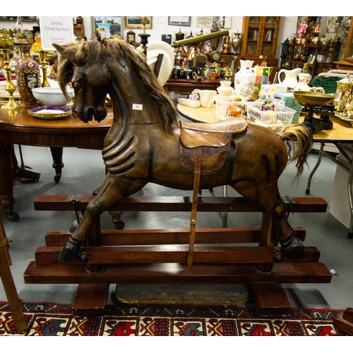 31 - CARVED WOODEN ROCKING HORSE