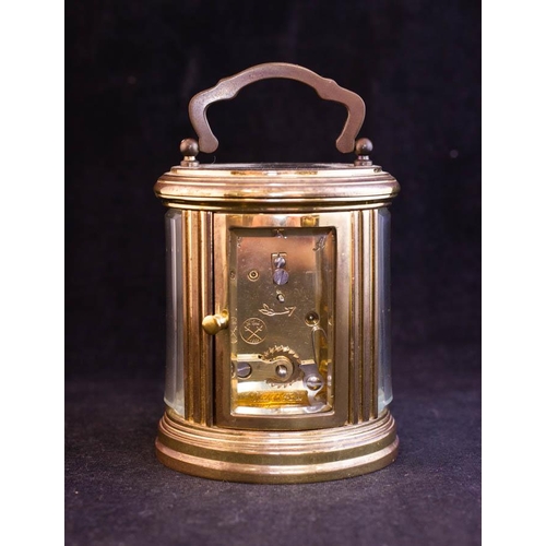 276 - OVAL FRENCH BRASS CARRIAGE CLOCK