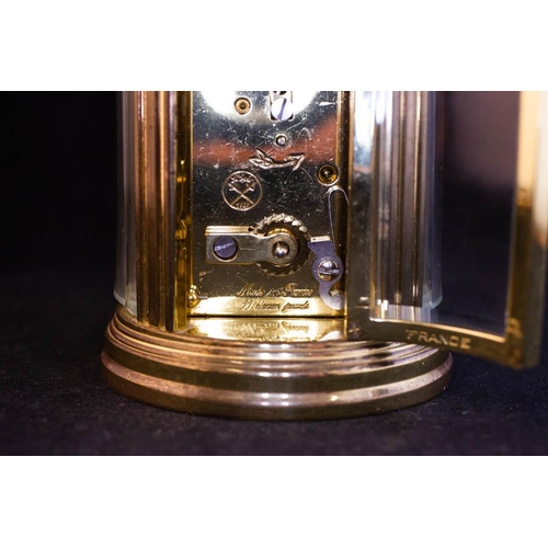 276 - OVAL FRENCH BRASS CARRIAGE CLOCK