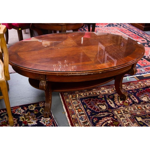 214 - OVAL COFFEE TABLE WITH GLASS TOP. 28 X 85CM X 47CM HIGH