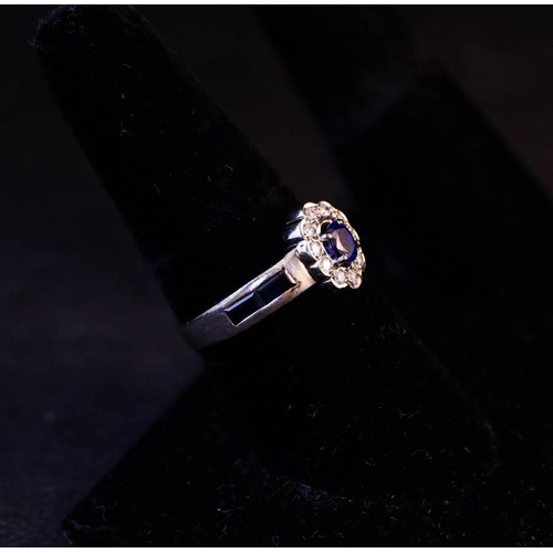 169 - 14K TANZANITE AND DIAMOND CLUSTER RING