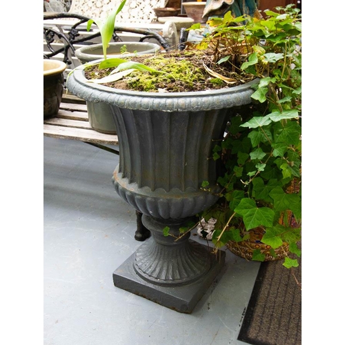 295 - PAIR OF CAST IRON FLUTED GARDEN URNS 75H X 59W CM