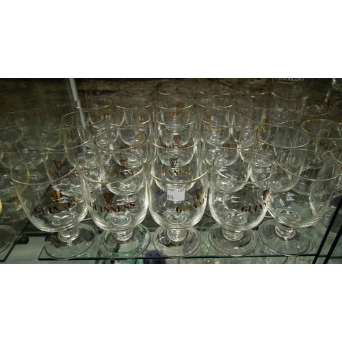 676 - 40 VINTAGE STEMMED GUINNESS GLASSES