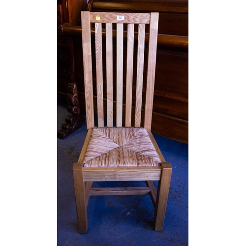 581 - PAIR OF SOLID OAK SLAT BACK DINING CHAIRS WITH RUSH SEATS