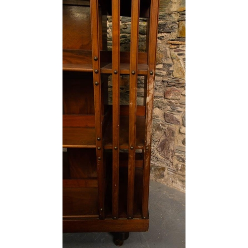 137 - MAHOGANY REVOLVING BOOKCASE BY MAPLE OF LONDON 60 X 60 X 120H CM