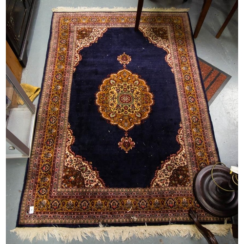 79 - NAVY GROUND WOOL RUG 190 X 124CM