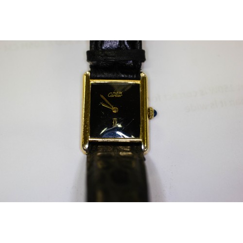 274 - CARTIER TANK LADIES WATCH GOLD ON SILVER MANUAL WIND WITH SAPPHIRE WINDER AND LEATHER STRAP. 30MM X ... 