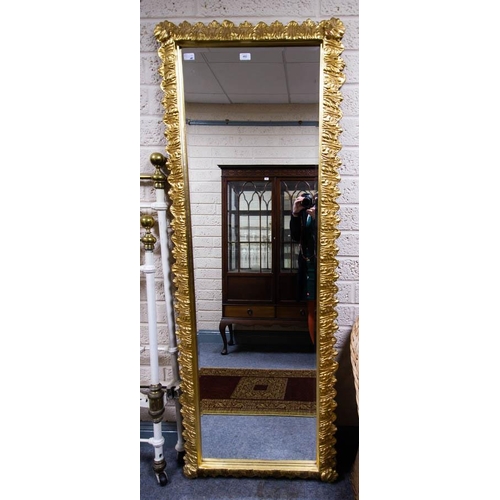 492 - ORNATE TALL BEVELLED MIRROR WITH GILT FRAME. 70 X 190CM