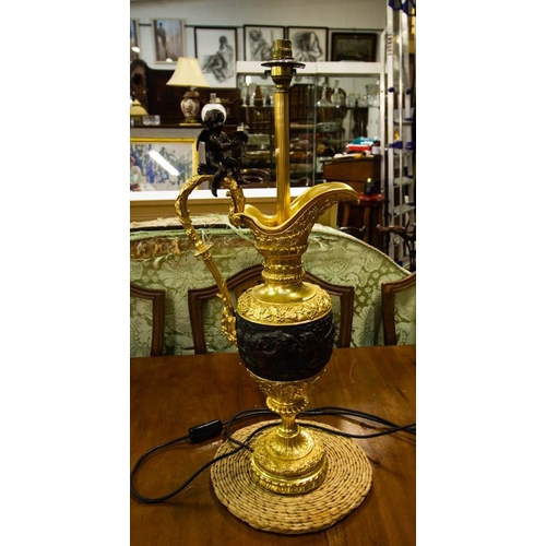 180 - QUALITY CARVED & GILT METAL EWER FORM LAMP WITH BRONZE CHERUB. 65CM HIGH