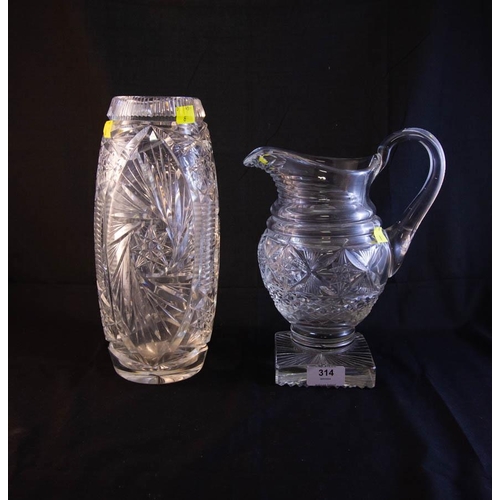 314 - CUT GLASS FOOTED JUG + CUT GLASS VASE