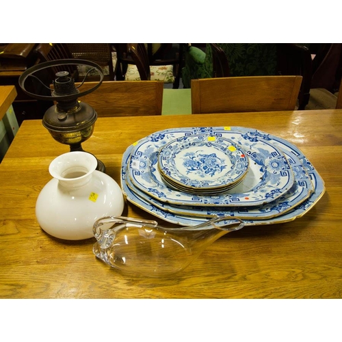 385 - LOT OF BLUE WILLOW PLATTERS + PLATES + OIL LAMP + HARRODS CARAFE