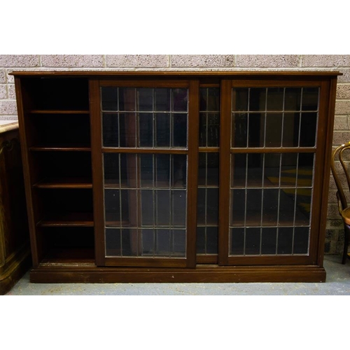 582 - ANTIQUE MAHOGANY 3 DOOR SLIDING BOOKCASE WITH LEADED GLASS. 
200CM W, 43CM D, 138CM H