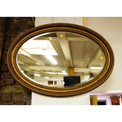 92 - OVAL GILT BEVELLED MIRROR 90 X 65CM