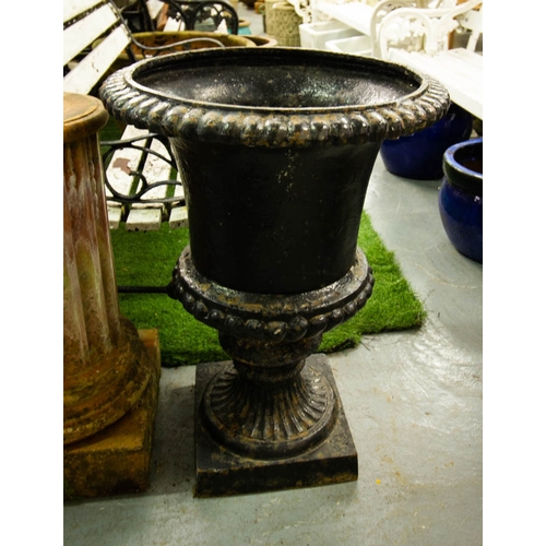 1 - PAIR OF BLACK CAST IRON FLUTED URNS. 65CM HIGH