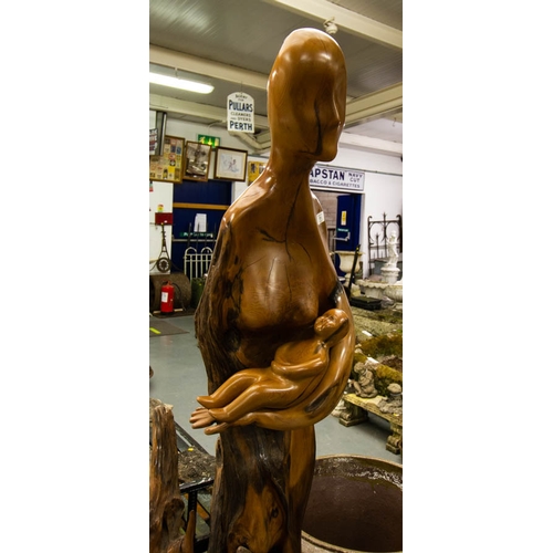 11 - WALNUT + DRIFTWOOD FIGURE DEPICTING MOTHER + CHILD ON POLISHED STONE BASE 180H - I CLANCY 95