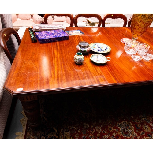 173 - EDWARDIAN MAHOGANY CUT CORNER DINING TABLE WITH 3 LEAVES . - AF 300L X 136W CM