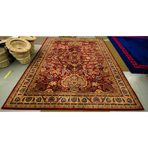 266 - BURGUNDY  GROUND MACHINE MADE RUG WITH NAVY FLORAL BORDER. 303 X 390CM