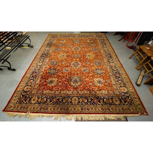 267 - ORANGE GROUND WOOL RUG WITH NAVY FLORAL BORDER. 368 X 130 CM