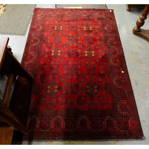 271 - RED GROUND FULL PATTERN RUG. 127 X 200 CM