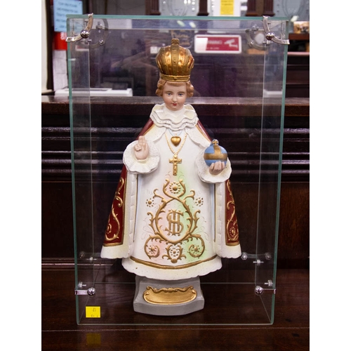 69 - STATUE OF CHILD OF PRAGUE IN GLASS CASE. 12 X 14 X 42CM HIGH