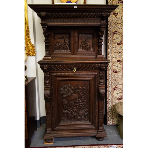 10 - HEAVILY CARVED DUTCH OAK CUPBOARD WITH PANEL DOORS. 120CM W X 55CM DEEP X 195 CM HIGH