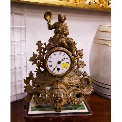 36 - ORNATE GILDED METAL MANTLE CLOCK WITH KEY. 25CM WIDE X 30CM HIGH