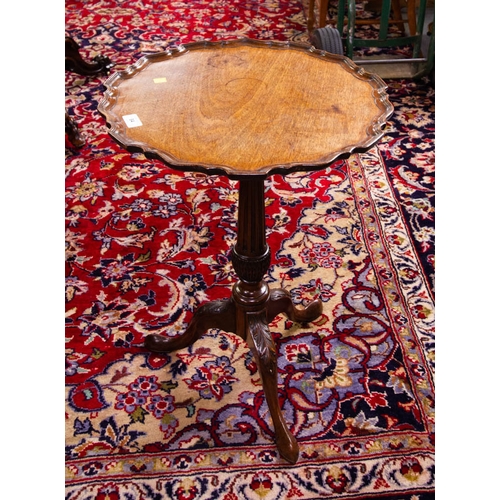 84 - SCALLOPED EDGE TIP UP MAHOGANY OCCASIONAL TABLE ON POD. 46CM DIAMETER X 64CM HIGH