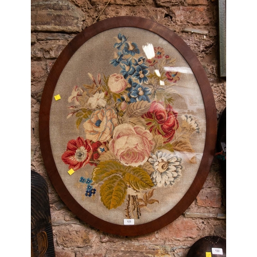 123 - ANTIQUE NEEDLE POINT FLOWER TAPESTRY IN OVAL MAHOGANY FRAME.  82 X 66CM