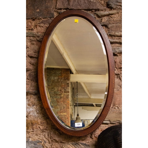 124 - INLAID OVAL BEVELLED MIRROR. 73 X 43CM