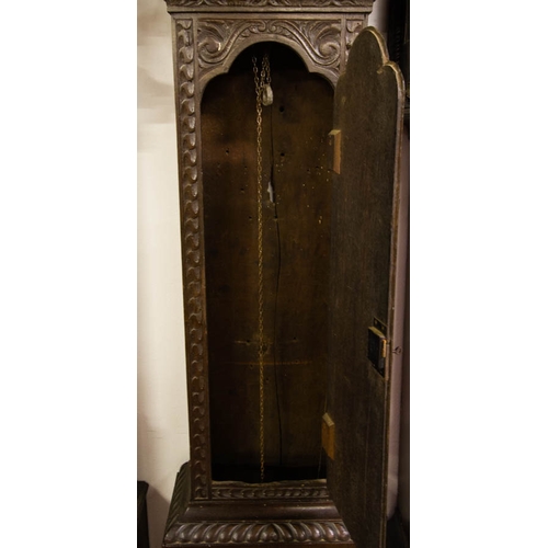 130 - OAK HEAVILY CARVED 30 HOUR GRANDFATHER CLOCK WITH BRASS FACE WITH WEIGHT + PENDULUM. 50 X 210 CM