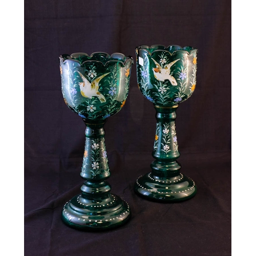 62 - PAIR OF GREEN HAND PAINTED SHAPED VASES. 34CM HIGH