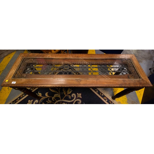 564 - RUSTIC CARVED TABLE WITH GLASS TOP. 152 X 46 X 77CM H