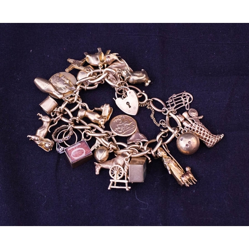 9CT. VINTAGE YELLOW GOLD CHARM BRACELET - 21 CHARMS . TOTAL WEIGHT 101GRAMS