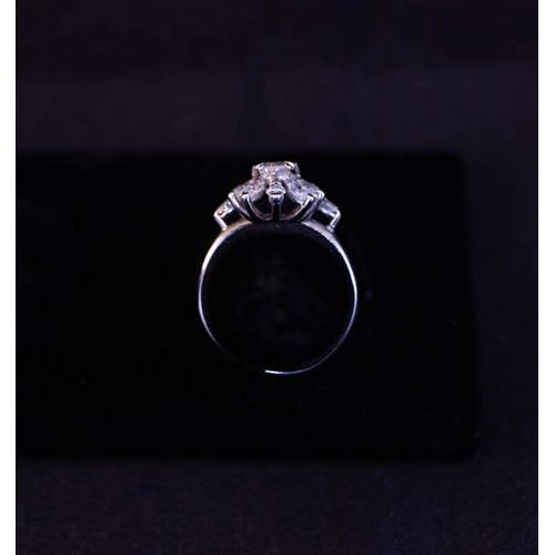 505 - SUPERB DIAMOND CLUSTER RING WITH OVAL DIAMOND CENTRE + DIAMOND PETALS SET IN PLATINUM - 1.6CT DIAMON... 