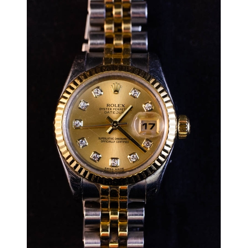 260 - ROLEX LADIES DATEJUST WATCH .
MODEL 179173 CHAMPAGNE 10 DIAMOND. 
OYSTER STEEL & YELLOW GOLD.  AUTOM... 