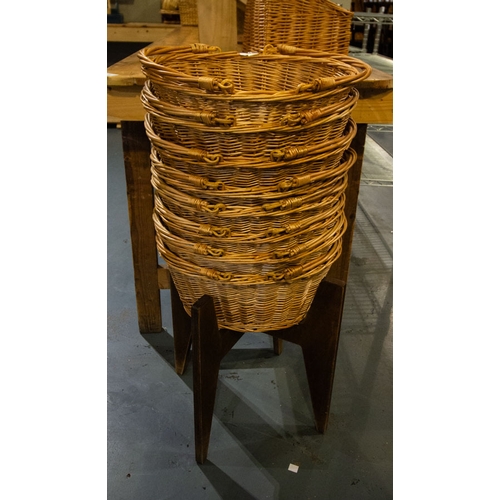 55 - 8 WICKER SHOPPING BASKETS ON STAND