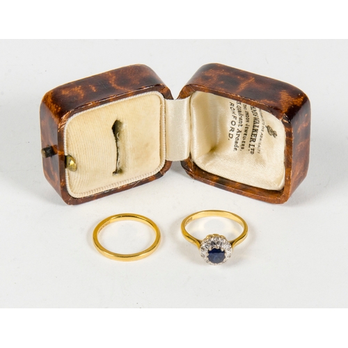 72 - A ladies Sapphire and Diamond Cluster Dress Ring, along with a ladies gold wedding ring contained in... 