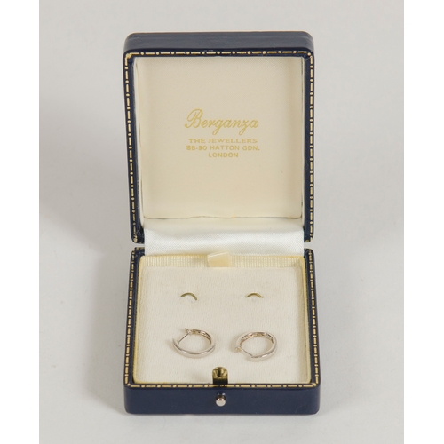 75 - A Pair of White Gold Diamond Set earrings, in a semi circular shape contained in box.
1.9 grams.