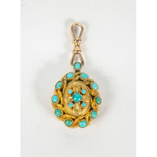 78 - A Victorian Gold and Turquoise pendant, set in a rope work pattern with engraved boarders.